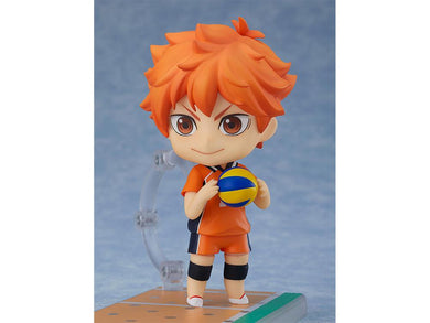 Shoyo from Haikyuu standing with a vollyball