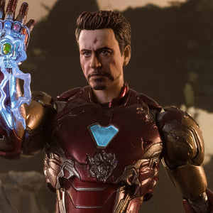 Tony Stark in his final Iron Man suit about to snap his fingers with the infinity stones
